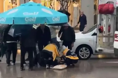 Bursa'daki kaza yaralanan şahsa vatandaş şemsiye tuttu